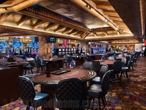 Sandblasted beams accent a tray ceiling above Ameristar Casino's gaming tables