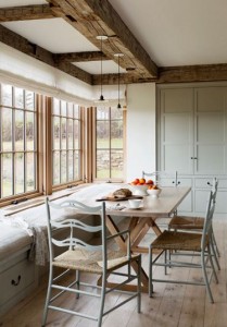 A Martha's Vineyard farmhouse featured in Lonny Magazine; kitchen with hollow reclaimed wood beams.