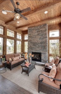 Beautiful ceiling system built with beams and panels that resemble real wood.