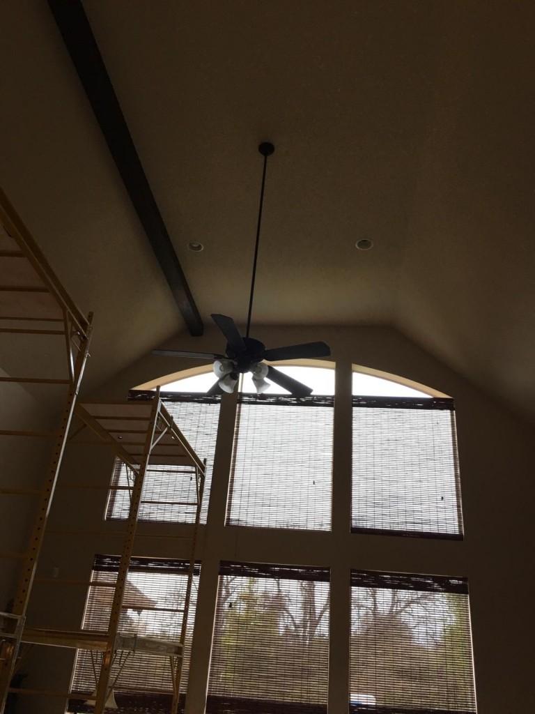 Chris installed the beams on a towering ceiling.