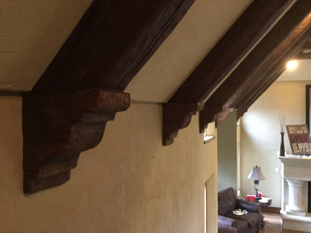Close up view of Timber beams and corbels used to create a decorative truss.