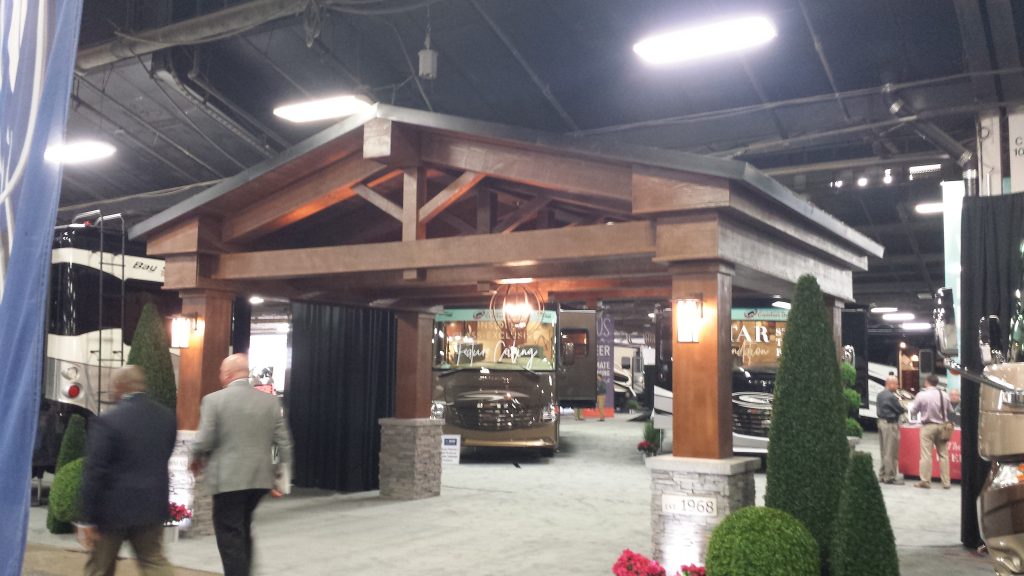 This stunning trade show exhibit is completely 'faux' on the outside, with wood style beams and faux stone column wraps.