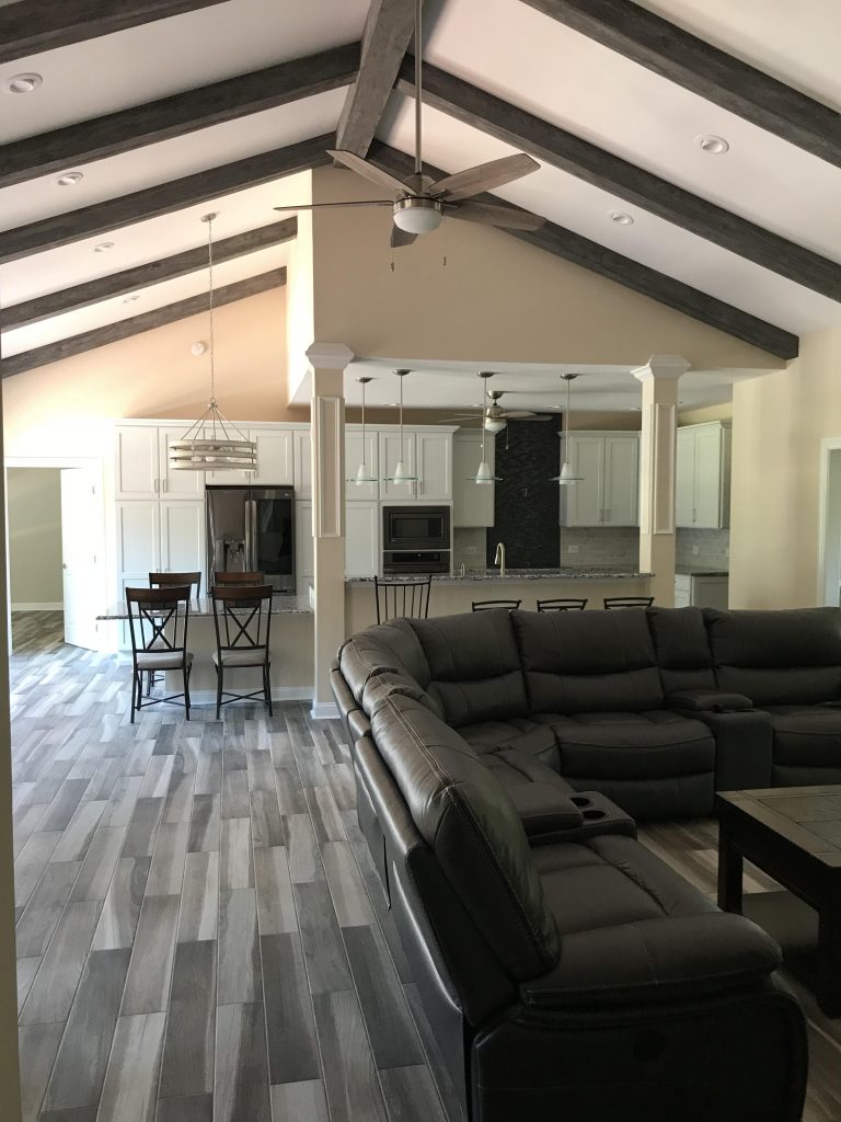 Great room with Driftwood Beams in Gray Patina color that work beautifully with the hardwood floors and furniture.