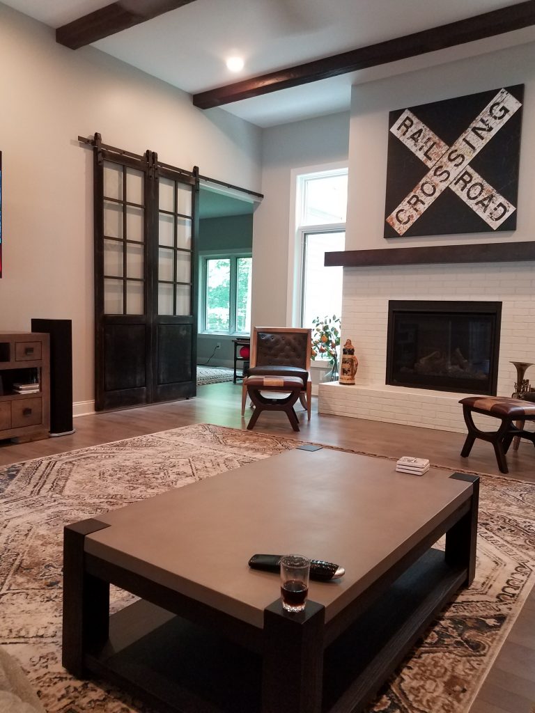 Railroad inspired great room redesign featuring Custom Beachwood beams on the ceiling.