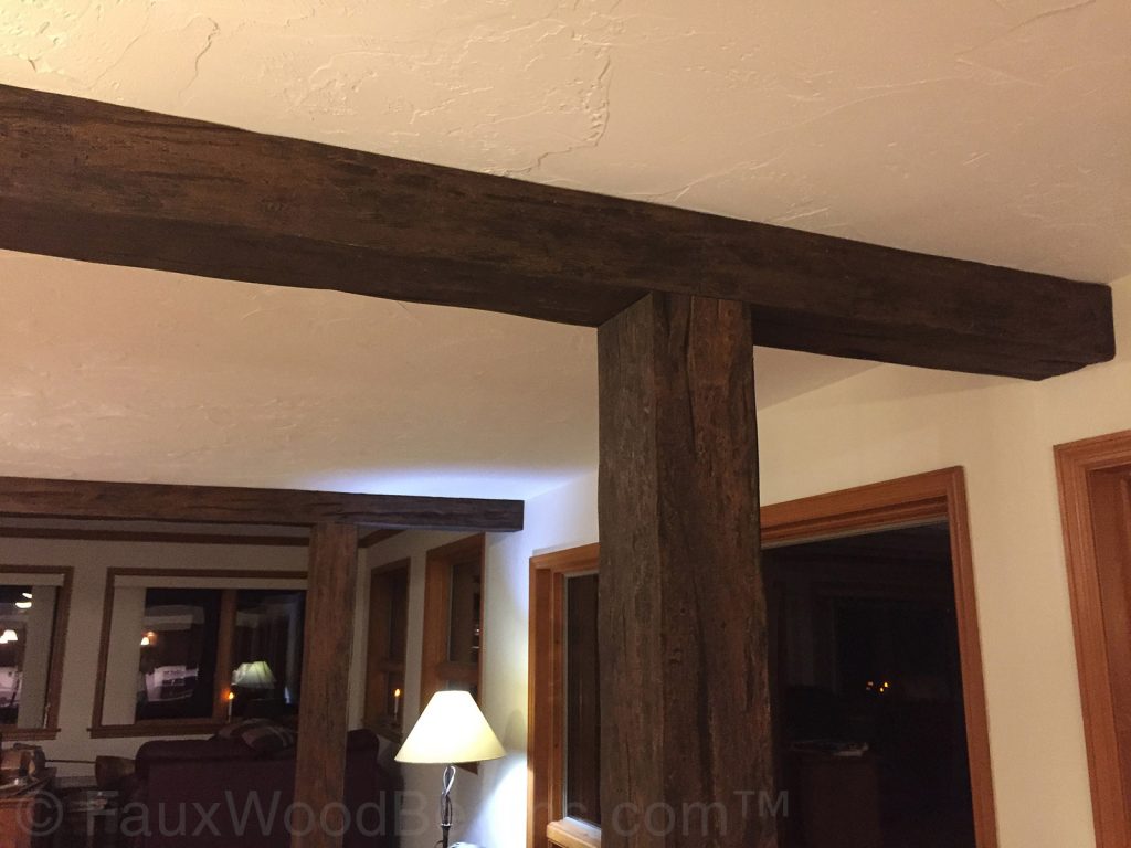 These beams and columns separated a long, narrow room into three distinct zones - a dining area, TV-area, and lounge.