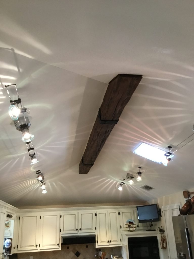 Elegant, simple kitchen design with a single Custom Timber beam on the ceiling.