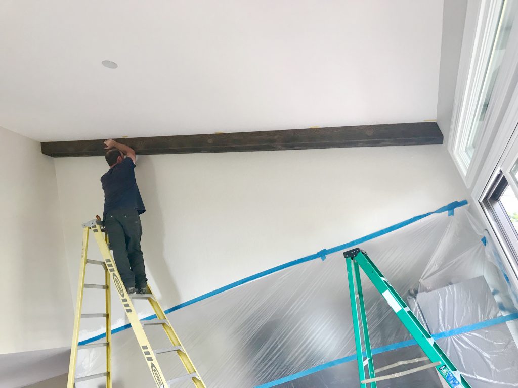 First beam going in; Resurfacing fireplace with plaster to look like concrete