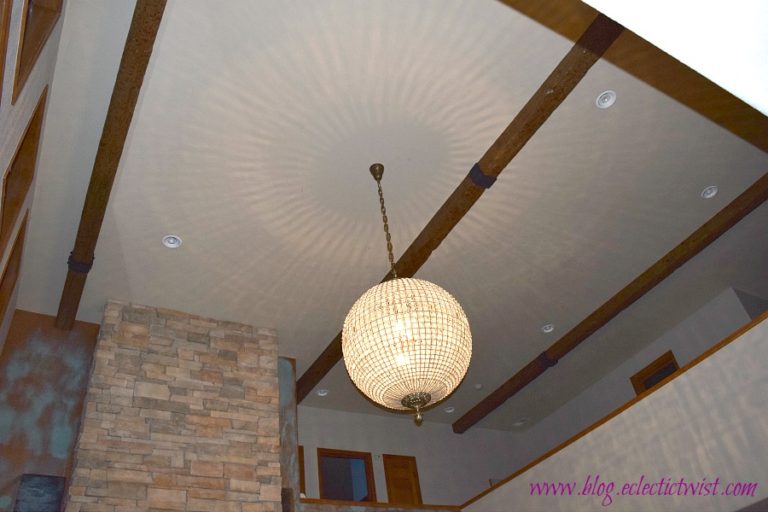 DIY wood beams installed on a home's 20 foot ceiling, project done by Tina of the Eclectic Twist blog.