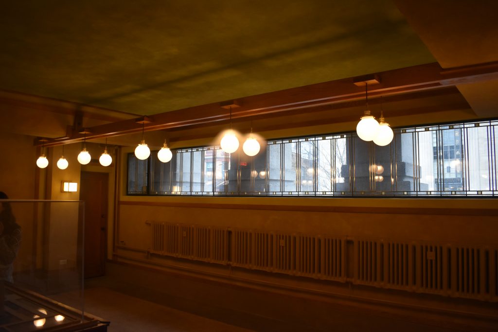 Suspended beams and lights in the Unity Temple