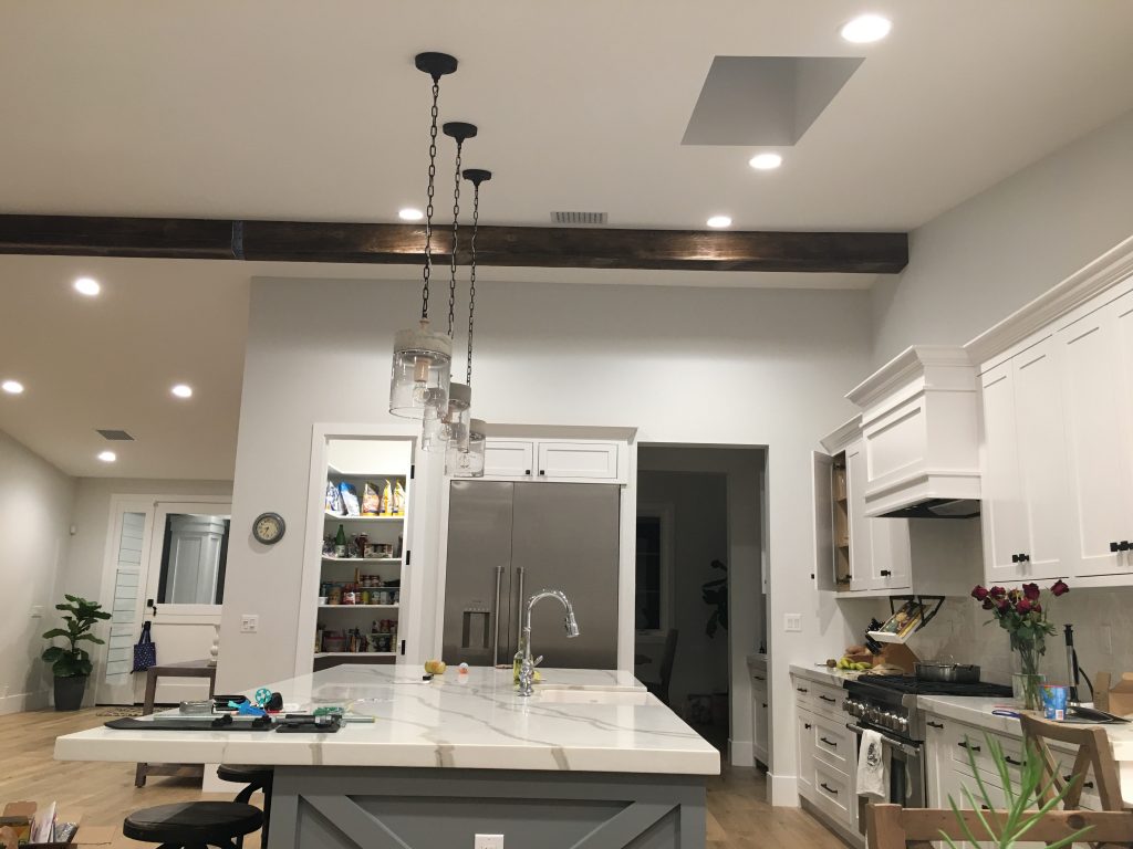 Joe and Kasey used two beams to span their kitchen's long ceiling.