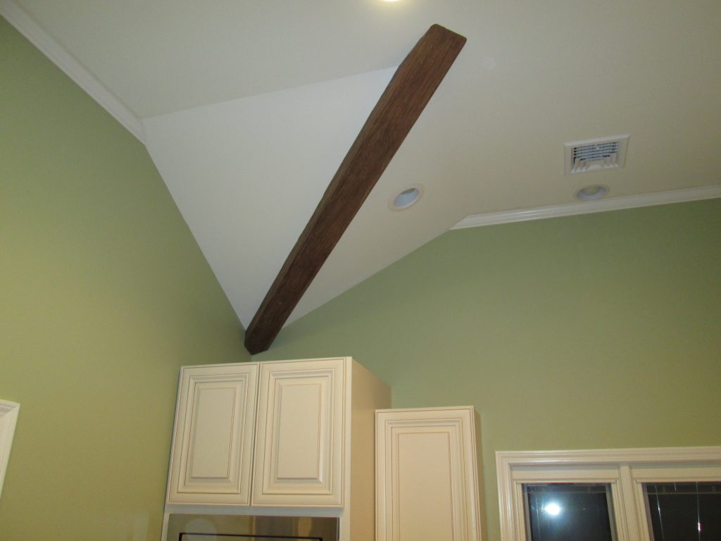 Dan expertly cut the ends of the beam to make it look like it was extending into the ceiling and wall