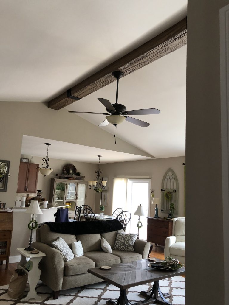 Ceiling fan installed through a Custom Heritage Beam.