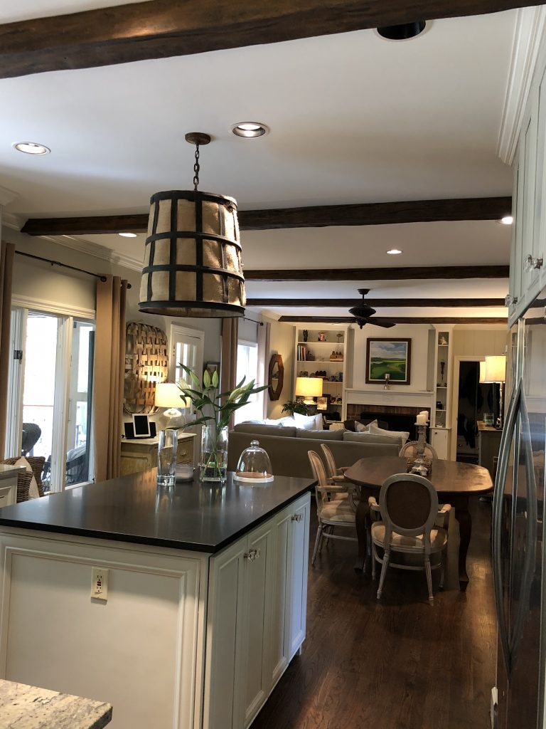 Jennifer beautifully mixed wood tones in her open plan kitchen and living room by adding Custom Timber beams