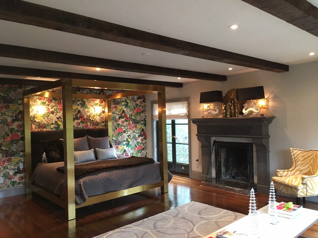 The bedroom's Hand Hewn box beams mirror the layout of structural exposed beams.