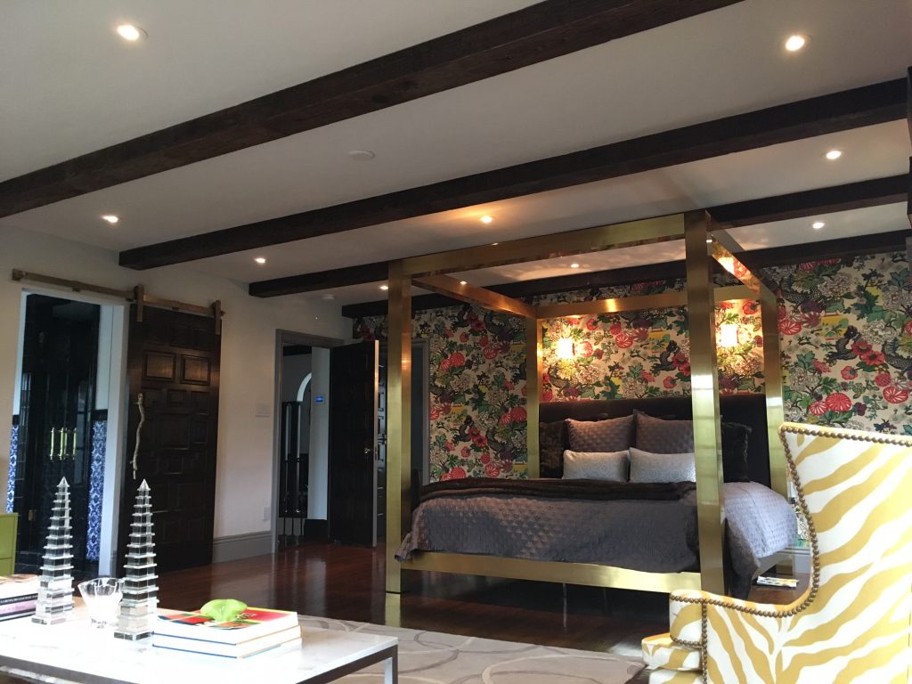 Hand Hewn box beams span the entire length of Heather's master bedroom.