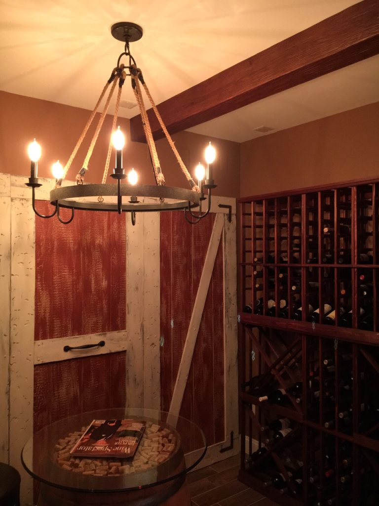 This home wine cellar project seamlessly blend modern beams with an existing, old-world design.