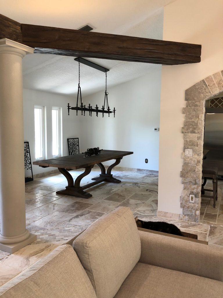 Caryn stained the beams to perfectly match other dark wood elements in her home; like this gorgeous medieval-style table.