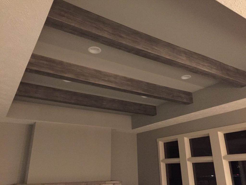 Gray Patina beams installed in a living room's recessed ceiling.