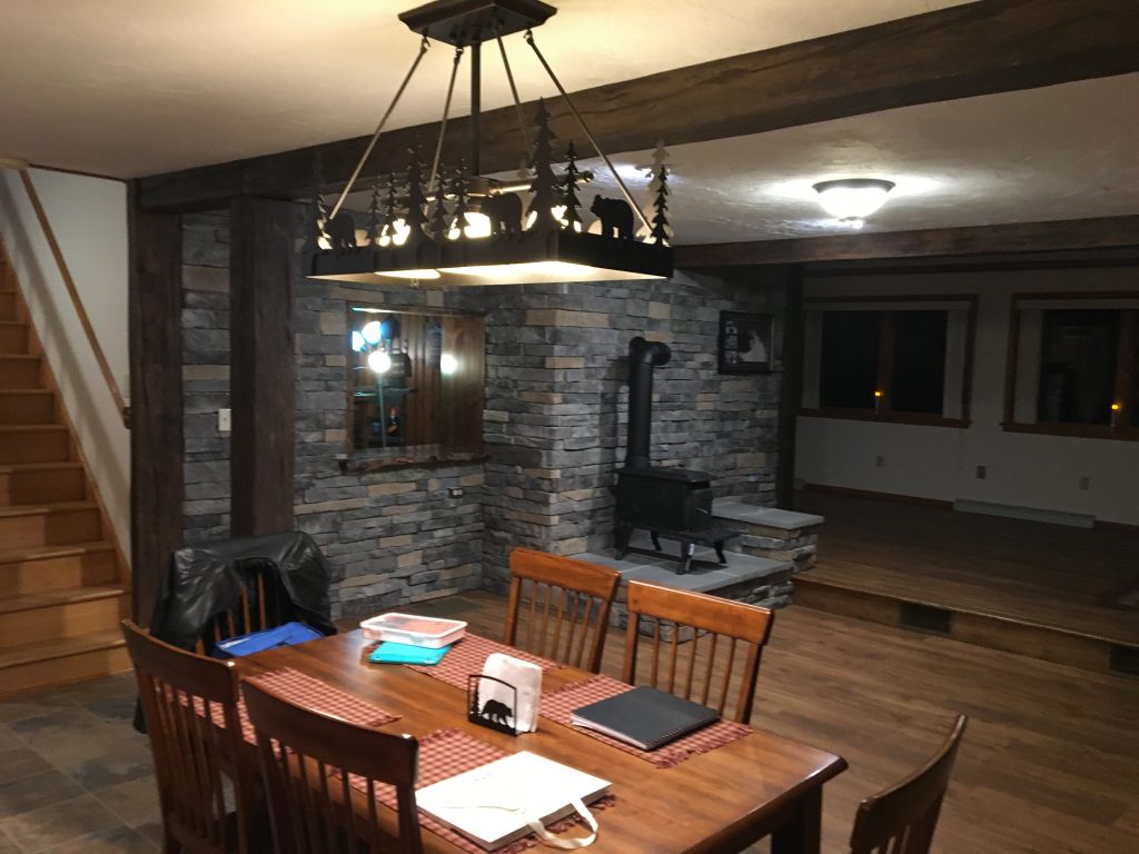 Kitchen view of an open plan room remodeled with Custom Timber beams.