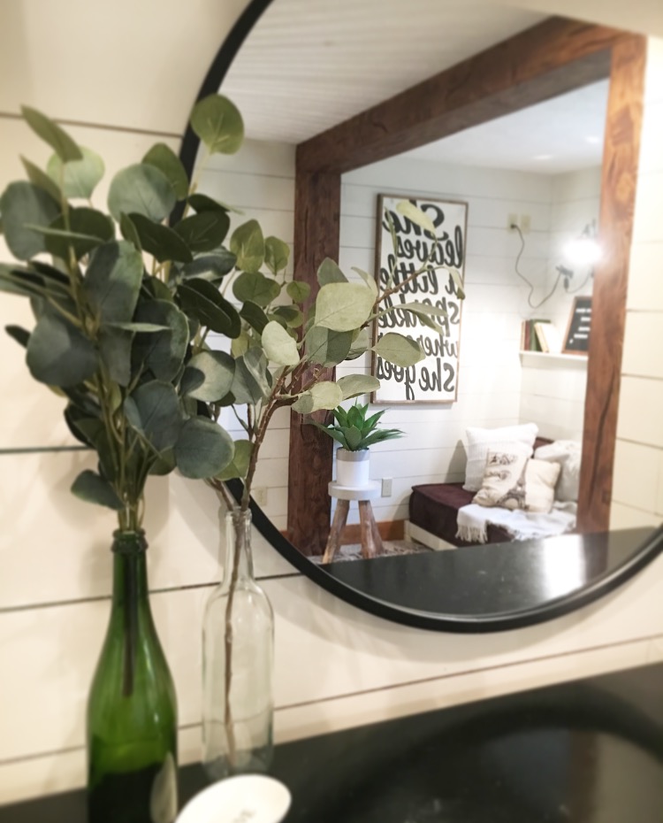 Mirror view of bedroom reading nook.