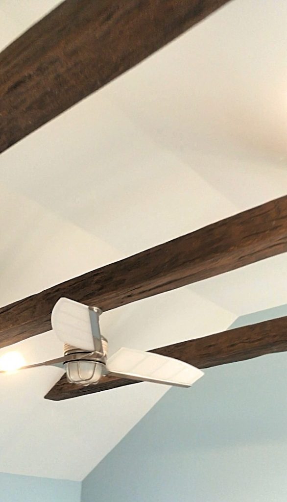 Suspended beams covered with Custom Timber Beams in Rich Walnut.