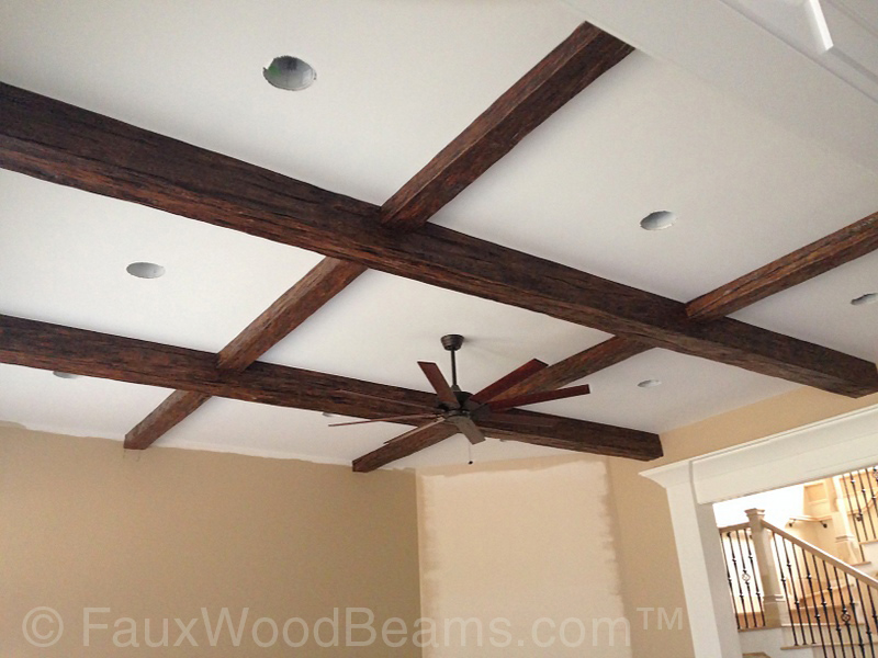Criss-crossed beams on a family room ceiling