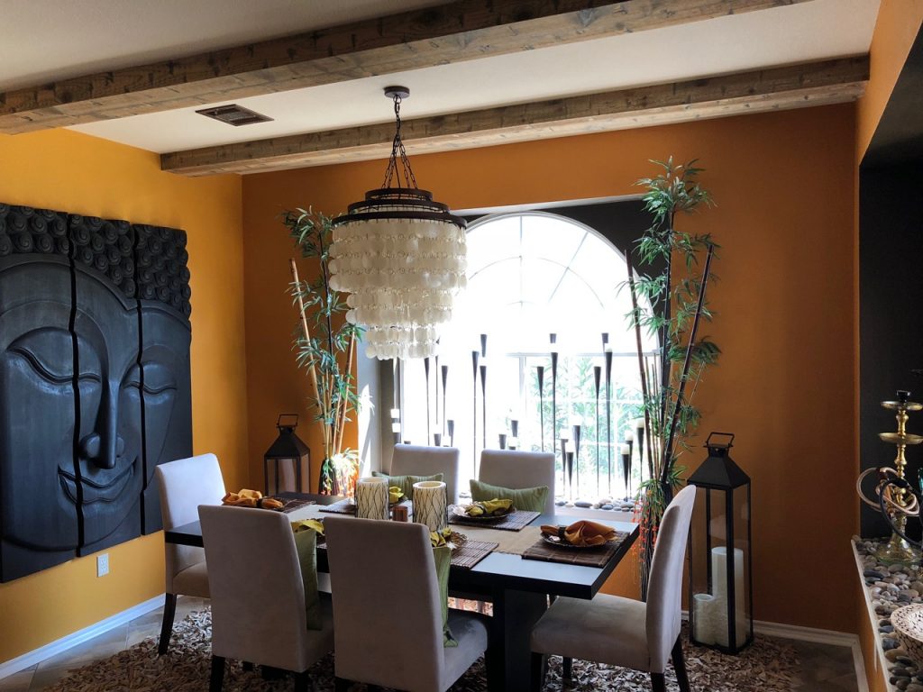 The dining room's ceiling beams matched those installed in the living room.