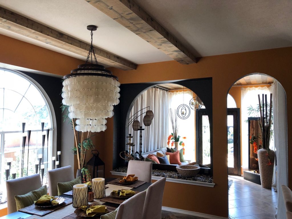 Elegant new dining room with Custom Hand Hewn beams in Rustic Natural finish.