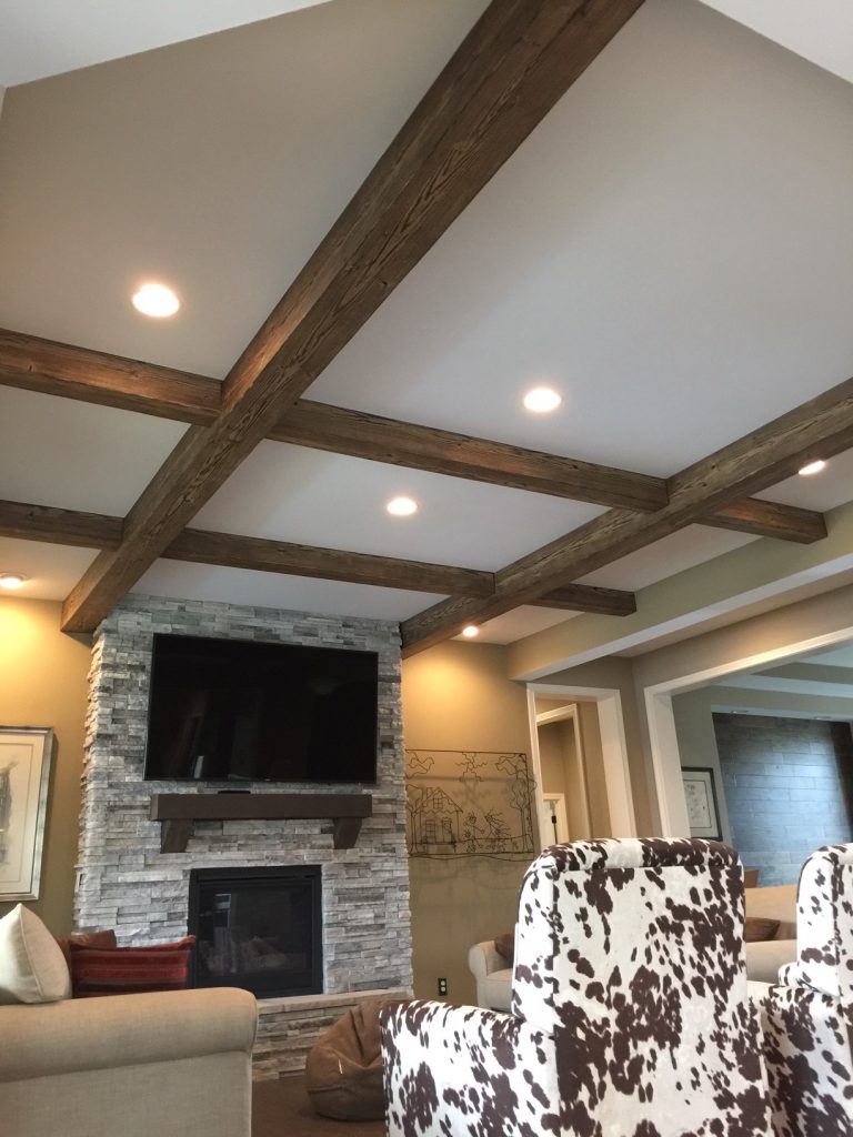 Replicating real load-bearing beams in a living room with Custom Aspen beams.