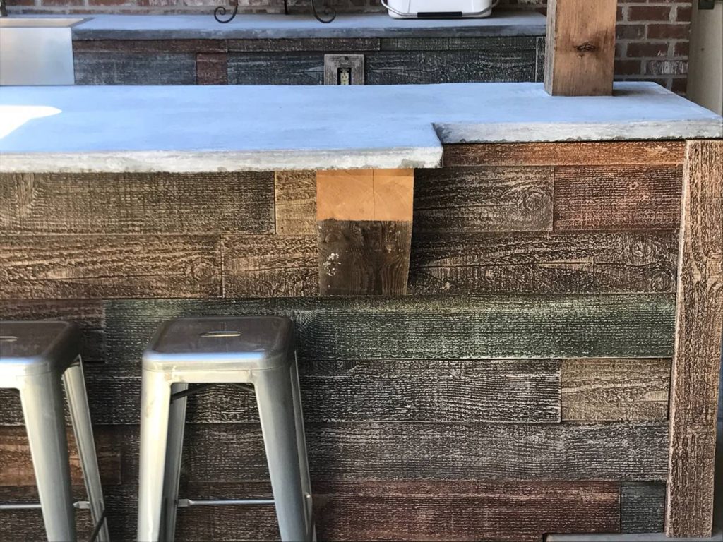 The concrete countertop and real wood supports pair perfectly to provide a rugged, outdoorsy look.