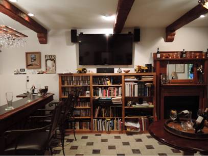 Basement man cave with cables and wires concealed inside the hollow Timber beams.