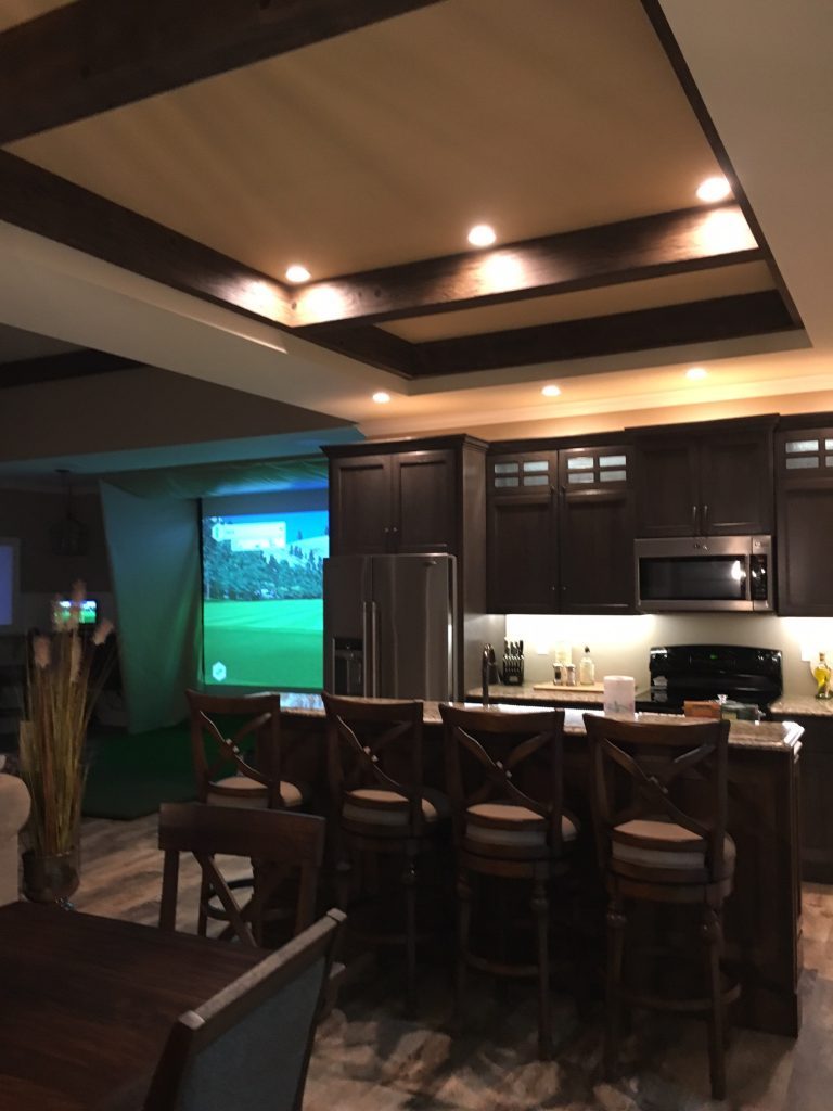 Beams installed in a recessed ceiling over an open plan kitchen