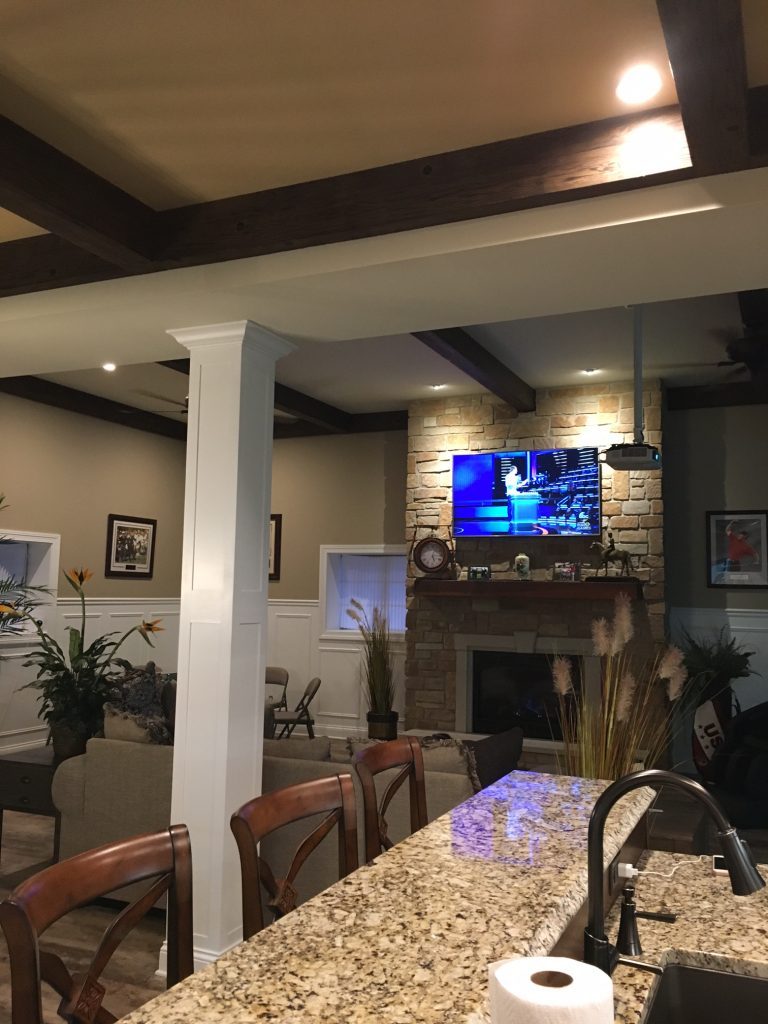 Open plan living room and kitchen with new beamed ceilings.