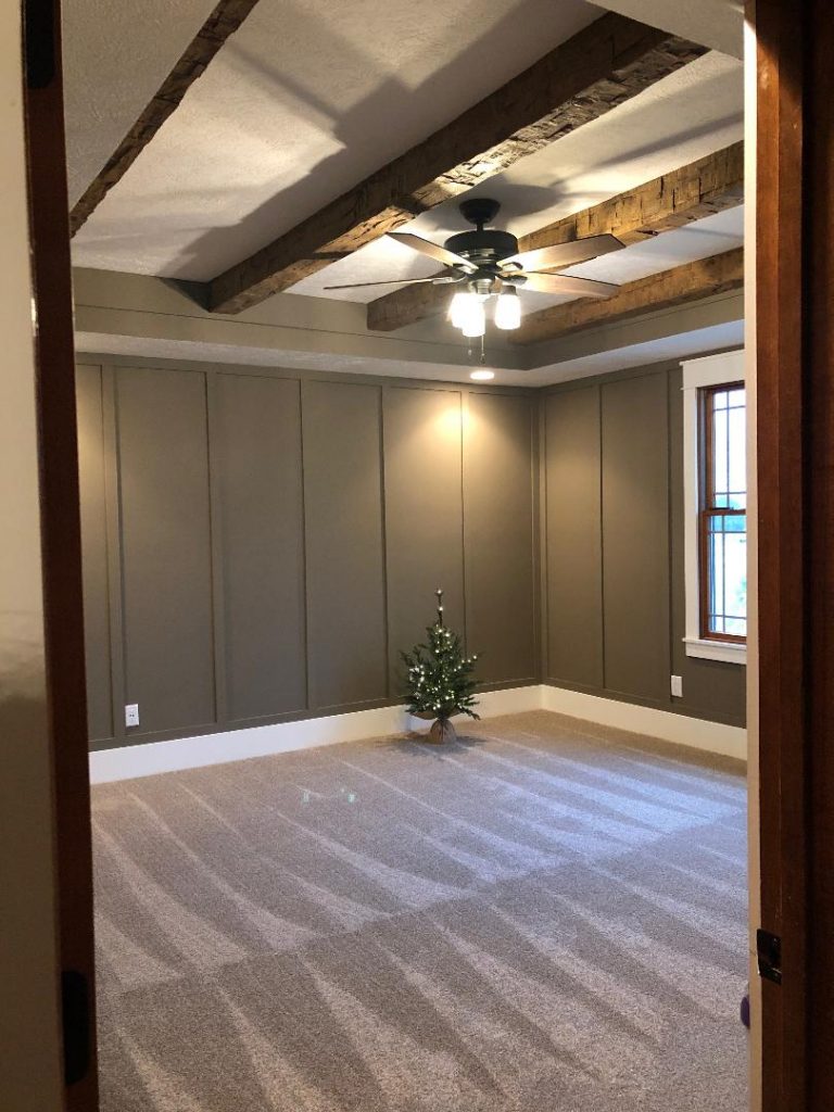 Quick Ship Rough Hewn beams installed on a bedroom ceiling.