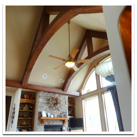 Curved trusses on living room's cathedral ceiling