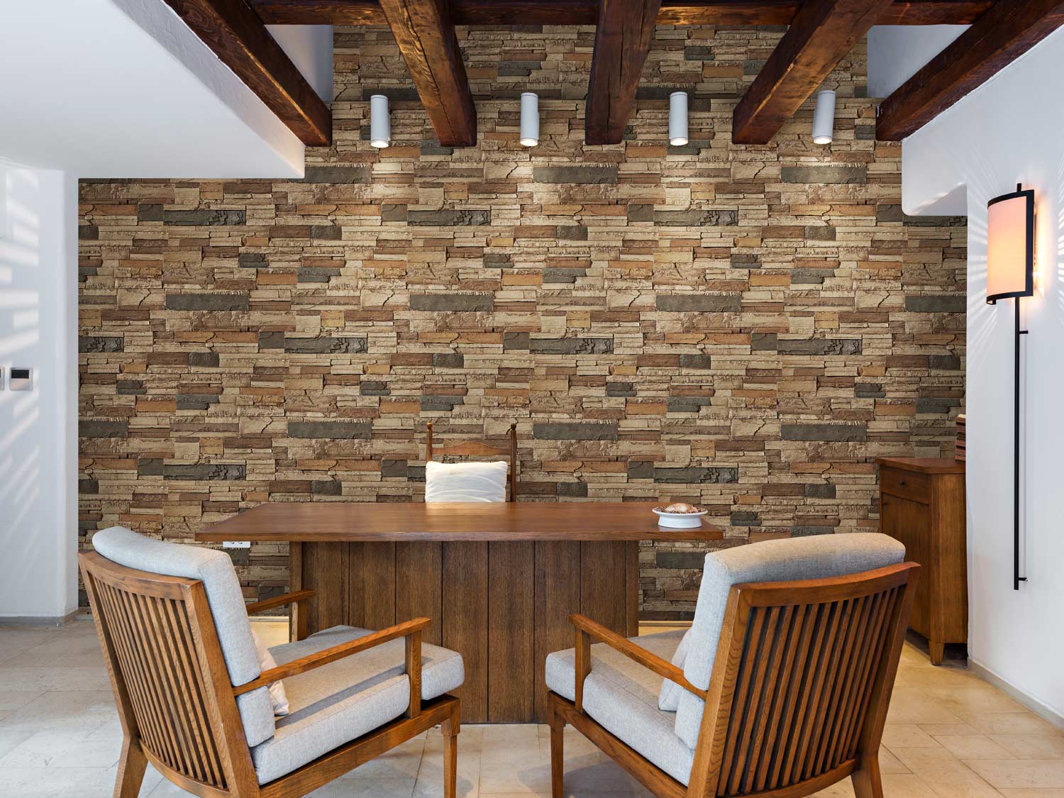 Faux wood beams and stone panels add visual interest to a home office space.