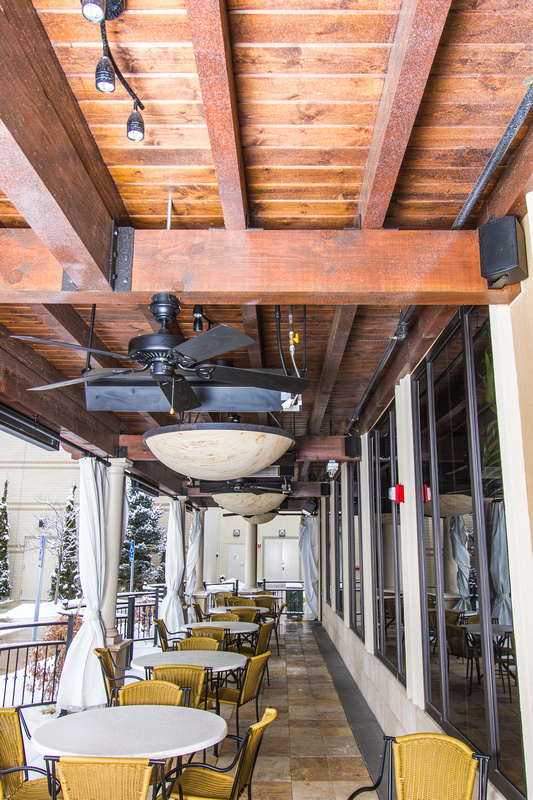 Barron Designs Woodland Faux Wood Beams on a restaurant's outdoor patio