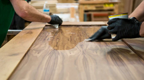 Applying a protective finish to an interior barn door