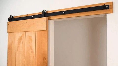 Interior barn door header support board