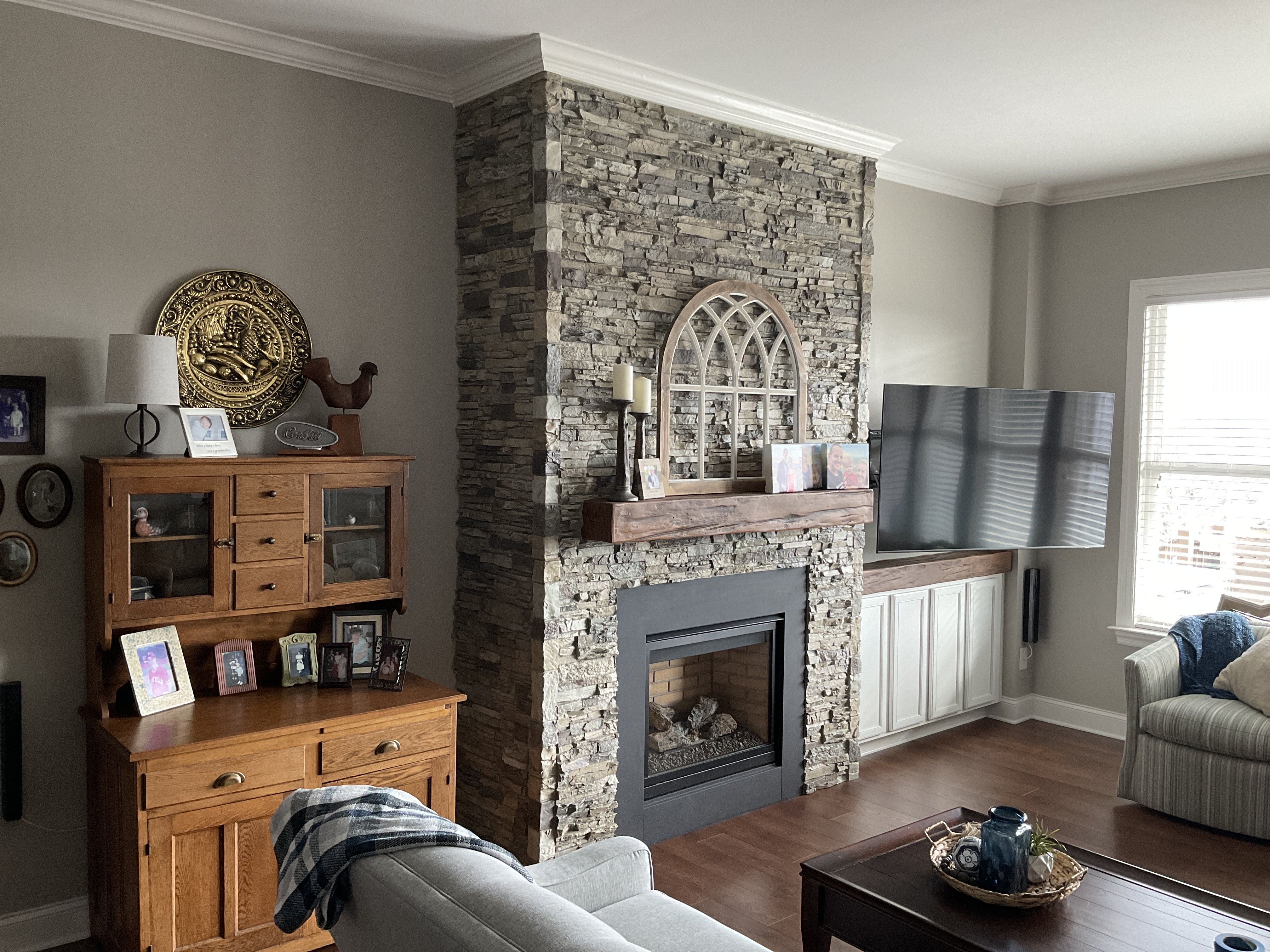 Faux stone fireplace surround with universal sound corners.