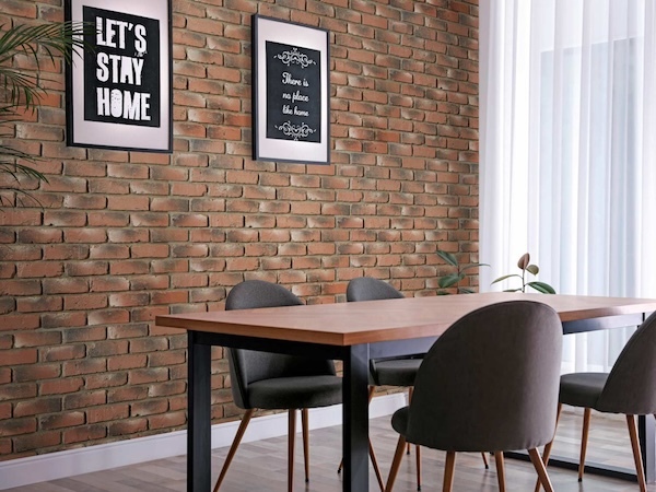 Old Chicago Faux Brick Wall Panels in Antique Brick installed on a dining room wall 