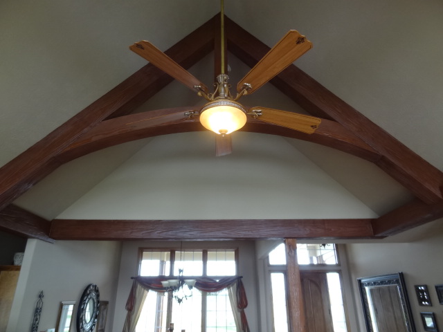 StainedArched Woodland beams for a beautiful truss ceiling design.