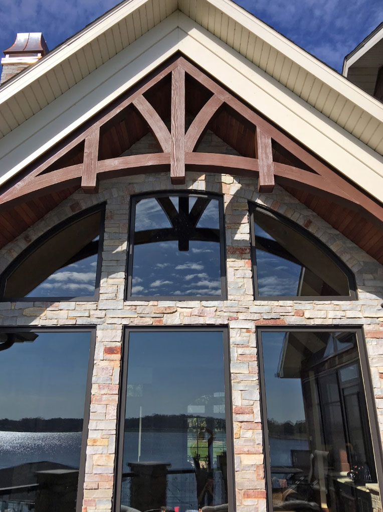 Faux stone panels add drama to the exterior of a home.