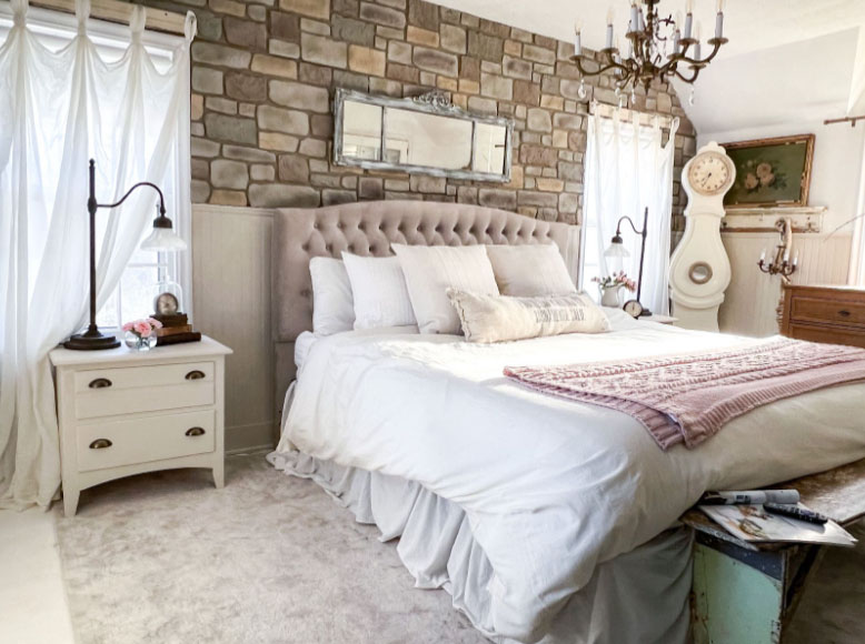 Use stone veneer panels in the bedroom to achieve a mountain lodge look.