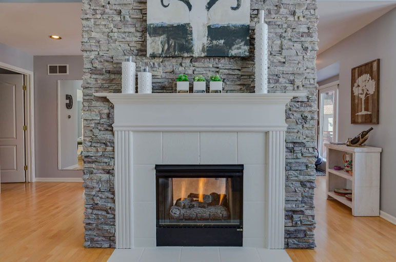 Use stone veneer to easily create a beautiful fireplace.