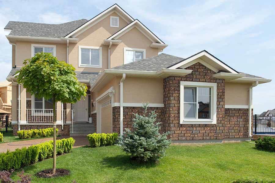 Regal chiseled faux stone wall panels on a home's exterior