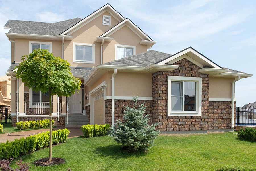 Regal chiseled faux stone wall panels on a home's exterior