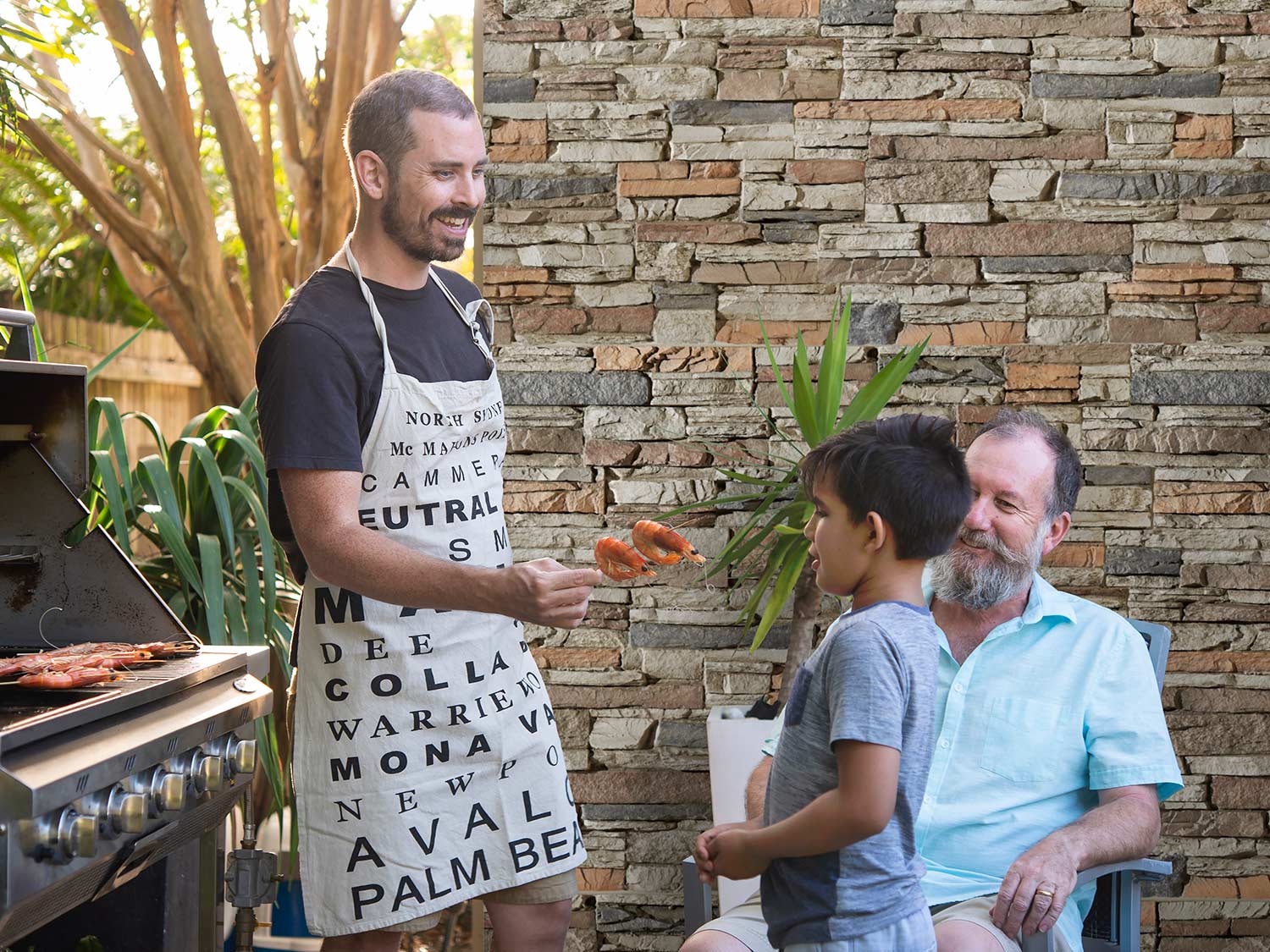 Outdoor Kitchen With Faux Stone Wall