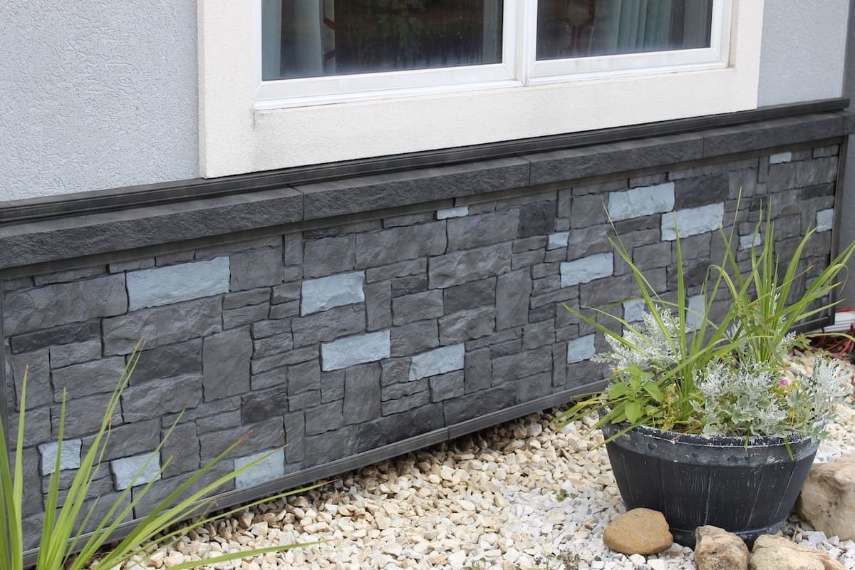 Novik Cobblestone faux stone foundation skirting in carbon color