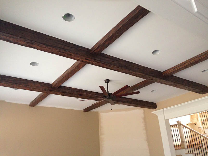 Criss-crossed beams on a family room ceiling